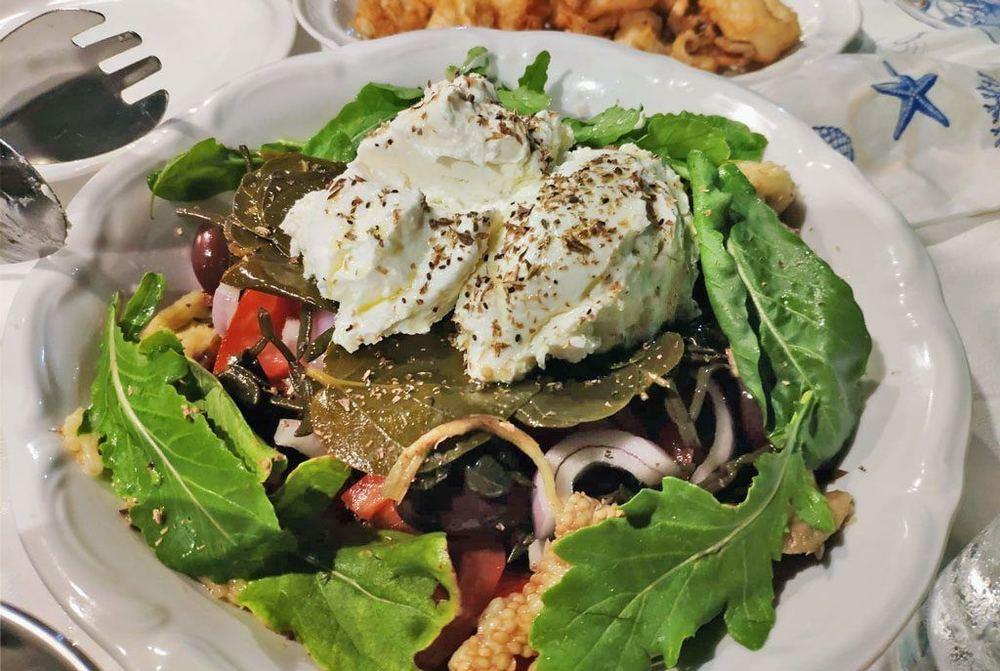 Mermizeli: barley rusks, tomato and a scoop of soft cheese at a Kalymnian taverna