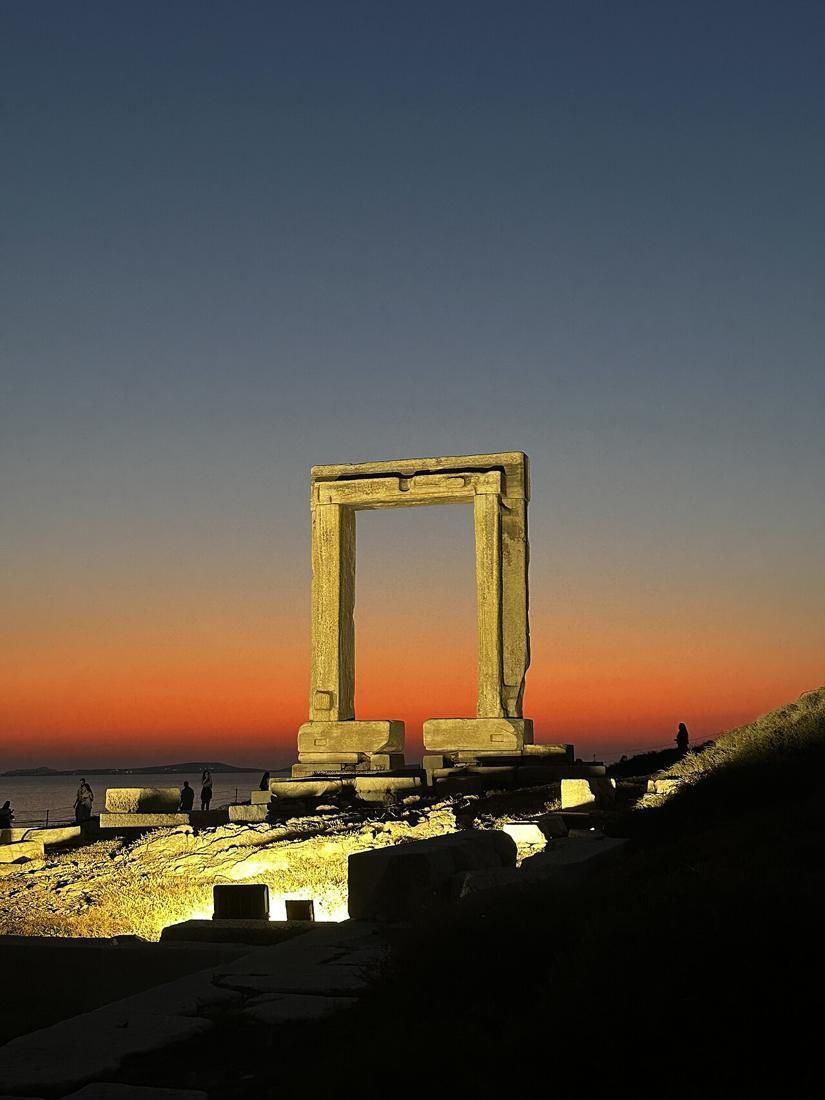 The Portara, the giant marble doorway of the unfinished temple, lit at sunset